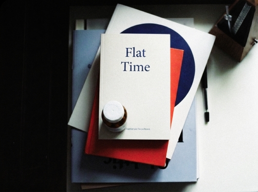 Flat Time publication and object on a desk