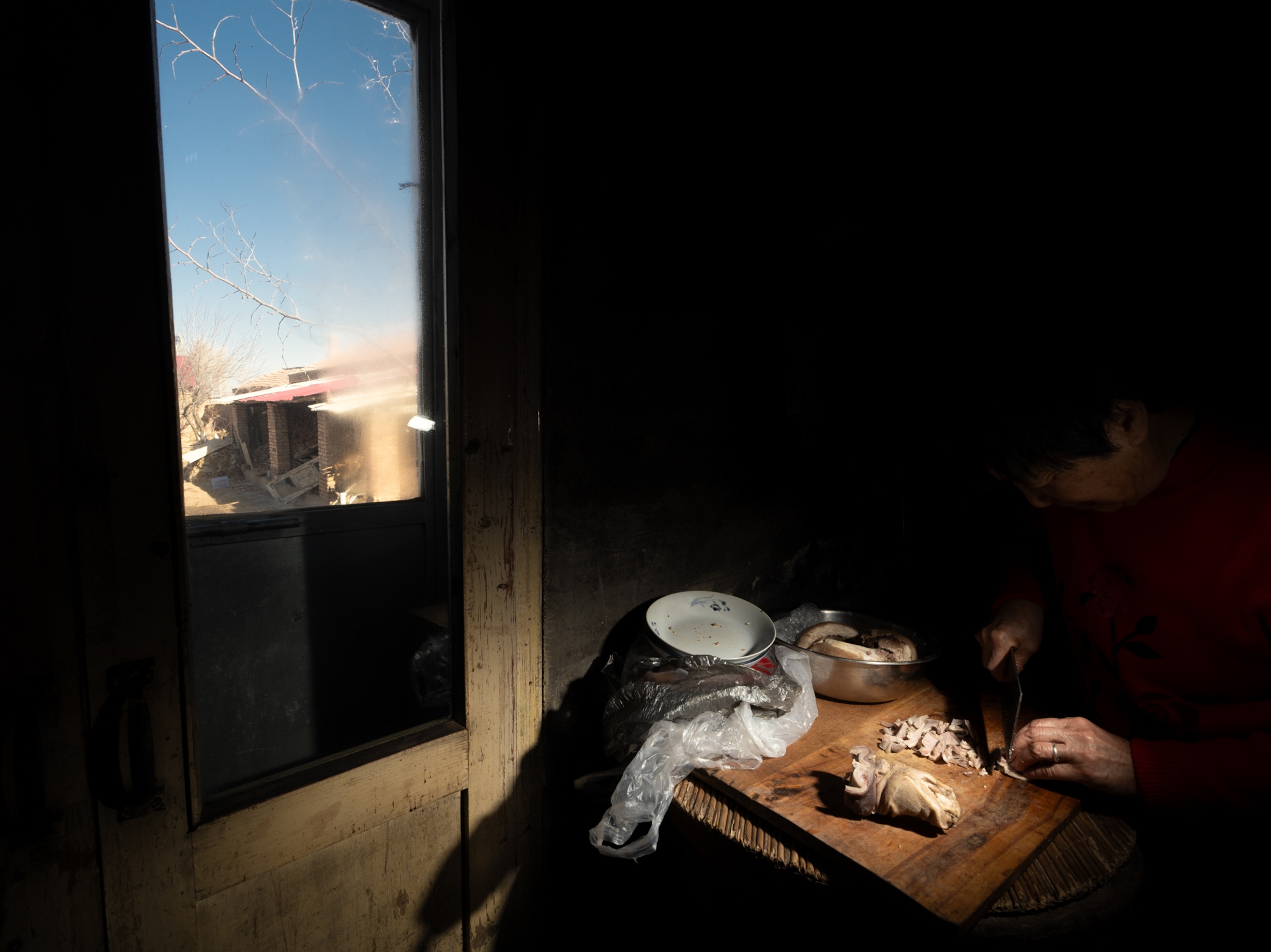 A domestic interior lit through a window