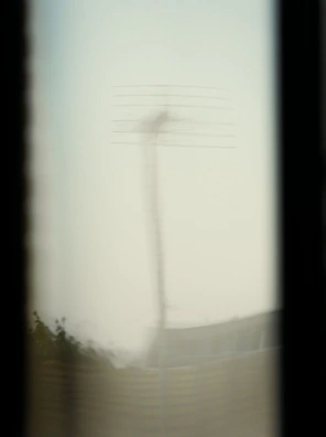 Blurred view of an antenna through a window