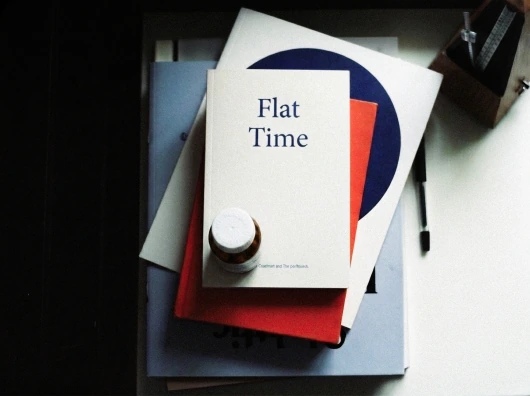 Flat Time publication and object on a desk