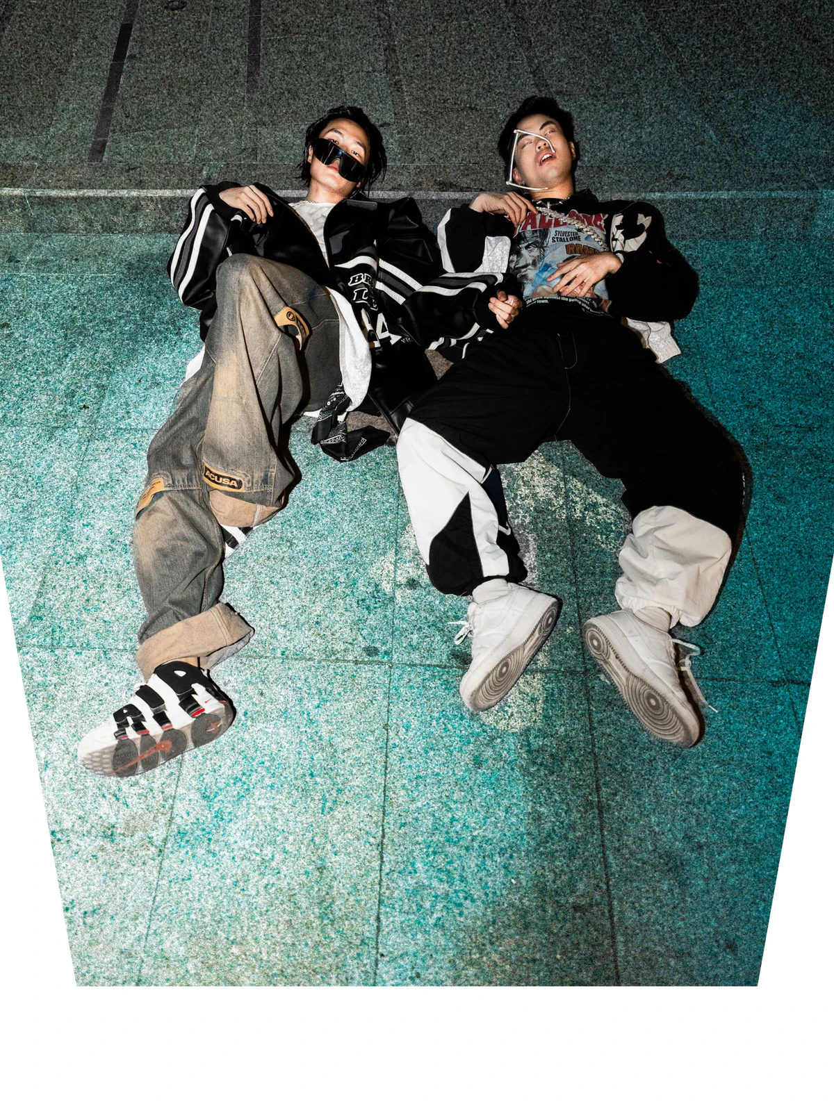 Black The Devil and GT photographed from above on a tiled floor