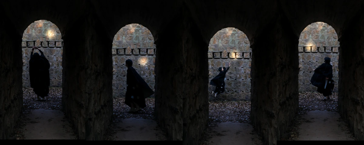 A four-part sequence of a figure moving through arched ruins
