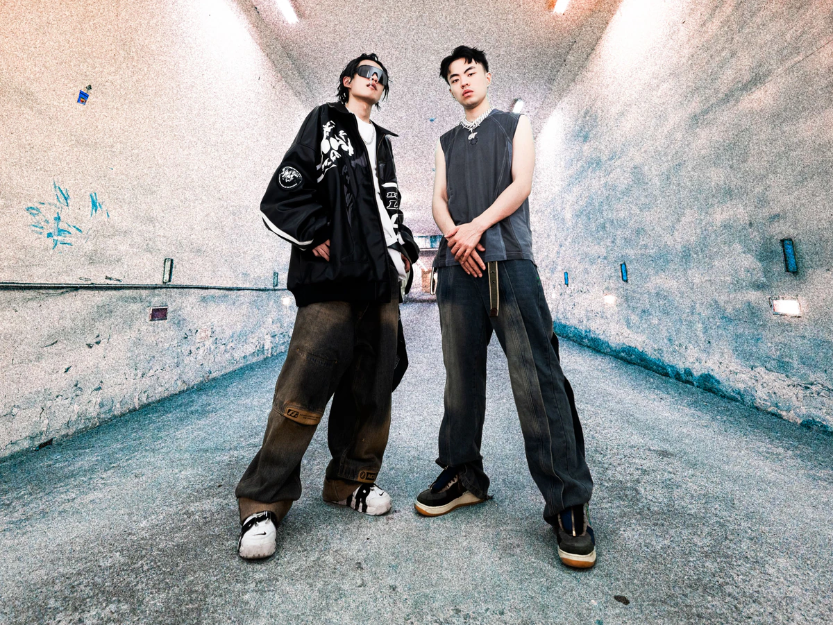 Black The Devil and GT standing together inside the tunnel