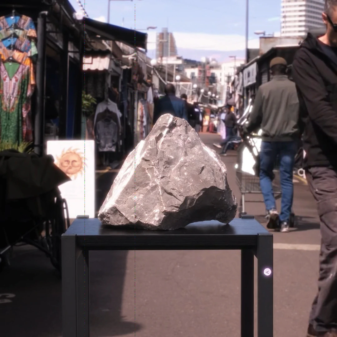 A stone being carried through a market