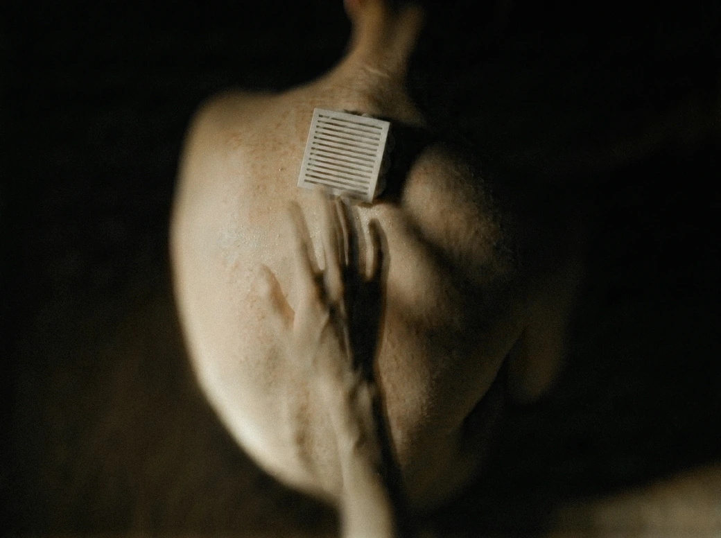 Frequency device placed on a person’s back