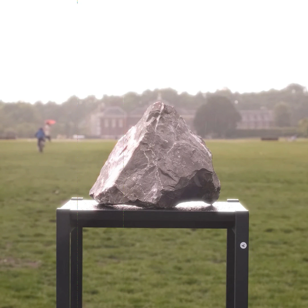 A stone resting in an open park
